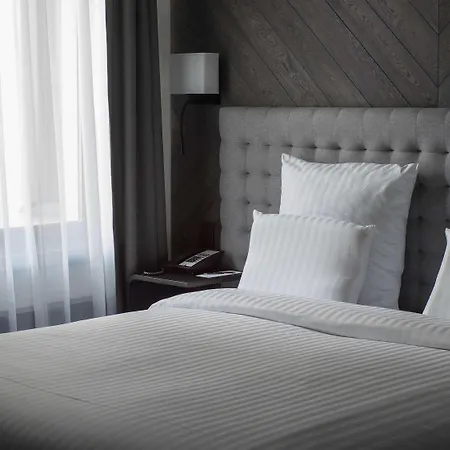 Pullman Riga Old Town Hotel Eksteriør billede A bed with white sheets